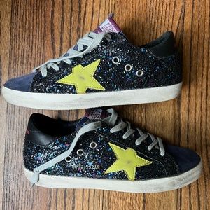 Golden Goose Superstar with blue, black, multicolor glitter, and neon green star